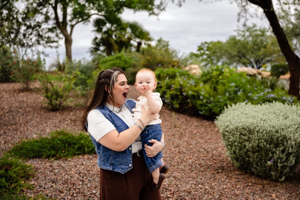 Aunt holding a baby during a family photography session at Anthem Community Park