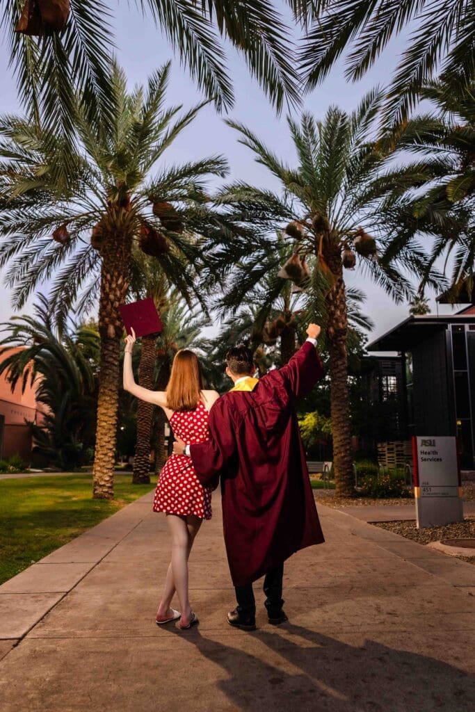 ASU graduate and fiancée celebrating near Palm Walk