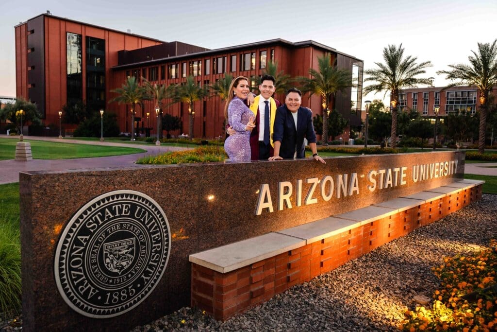 ASU graduation family photo by the Arizona State University sign
