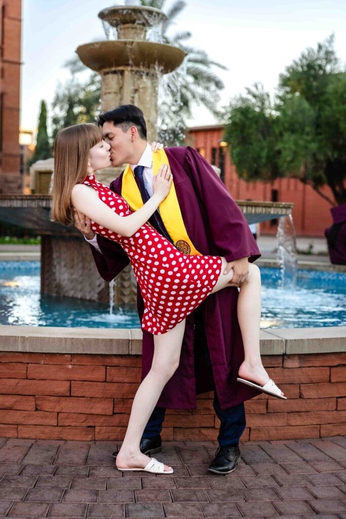 ASU graduation photo with fiancée near Old Main fountain