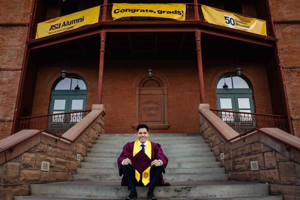 ASU graduation portrait on the Old Main steps at Tempe campus