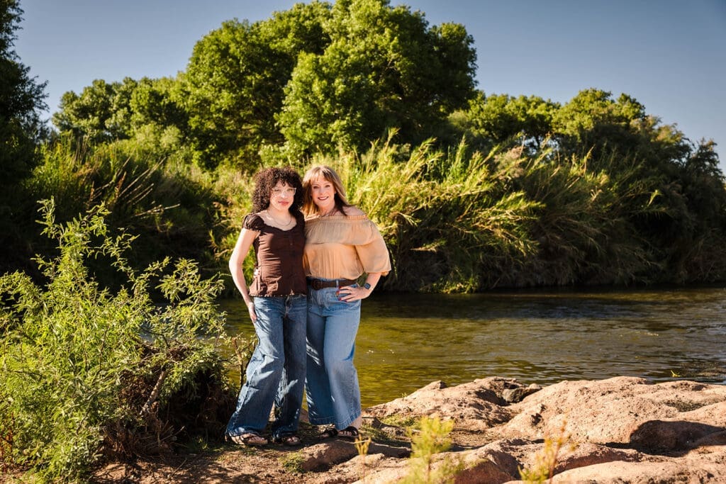 Mother and daughter standing near the river during a family photo session in Mesa, Arizona.