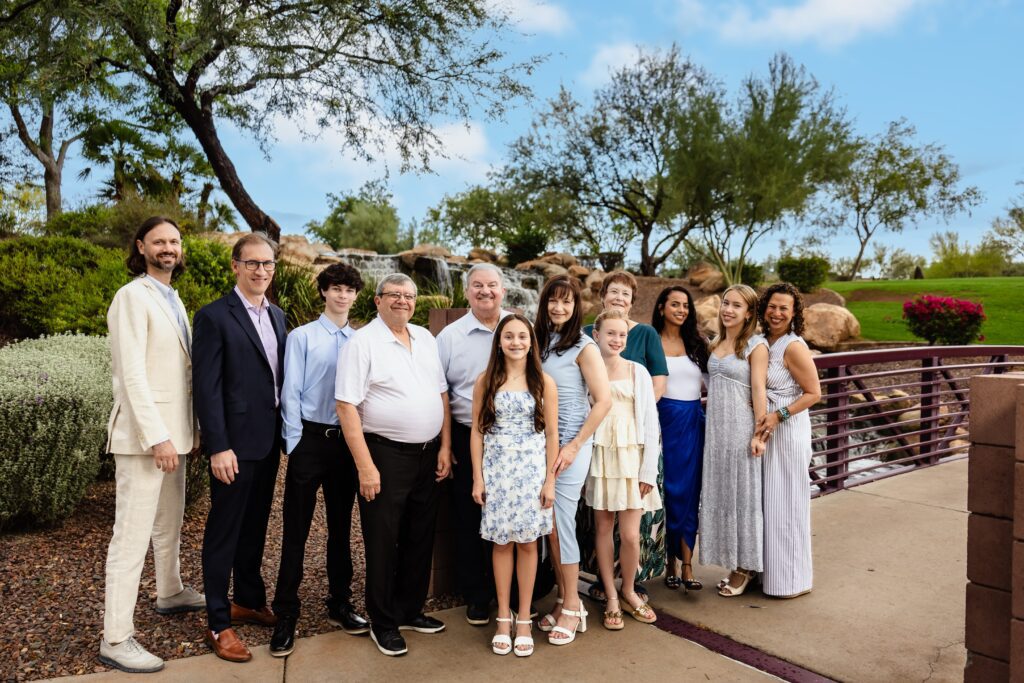 Family members standing together on the steps at Anthem Community Park